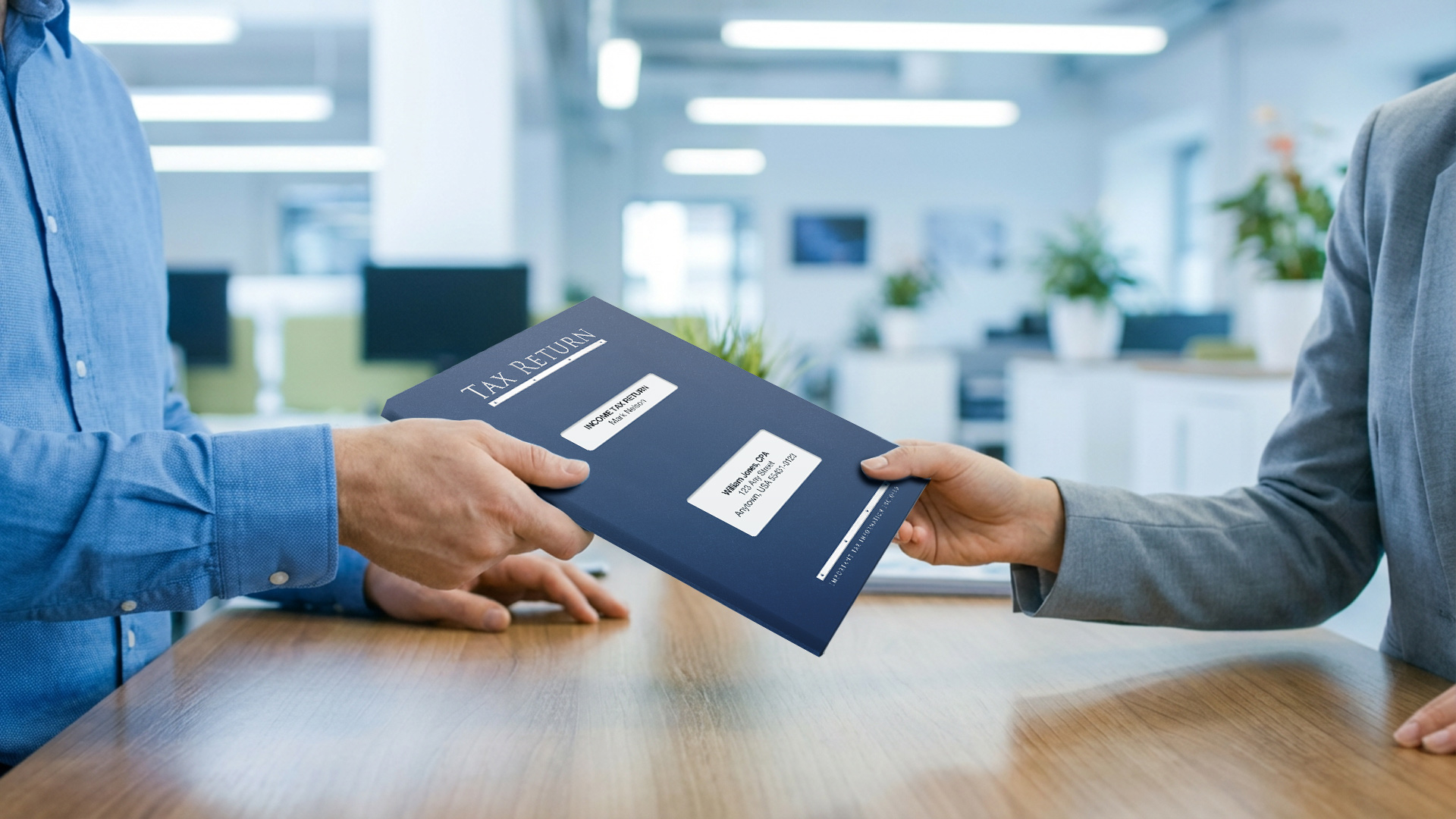 Tax preparer handing a completed tax return in a navy slip sheet folder to a client